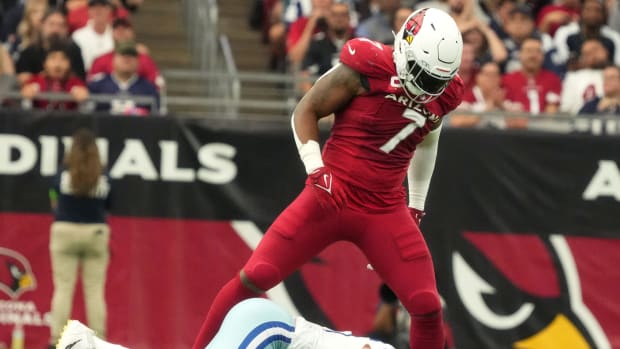 Arizona Cardinals linebacker Kyzir White (7) stands over Dallas Cowboys tight end Luke Schoonmaker (86) after breaking up a pass play at State Farm Stadium in Glendale on Set. 24, 2023.  